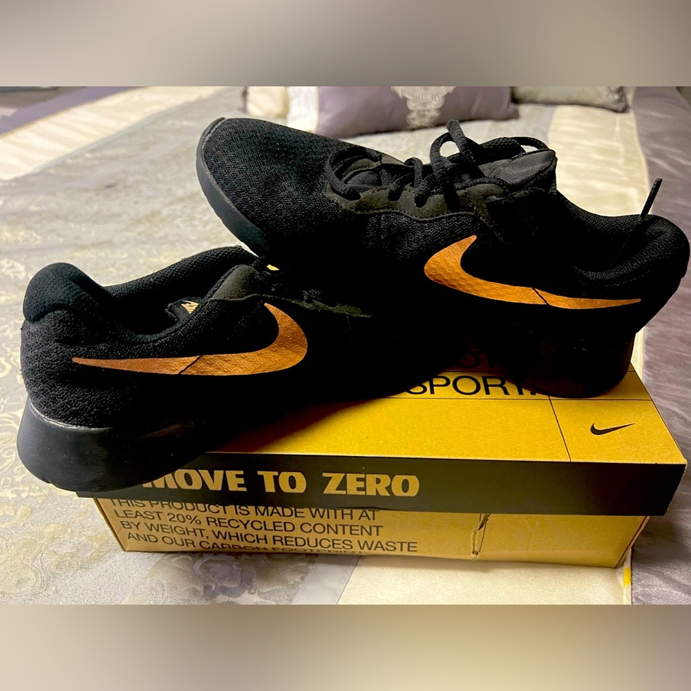 Womans Black and Gold Nike